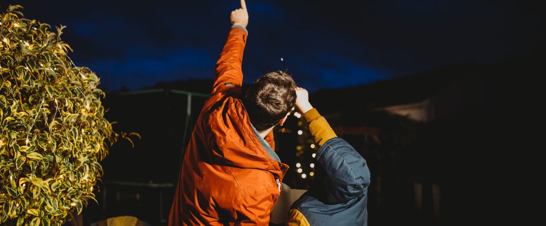 Man and boy counting the stars in the constellation of Orion