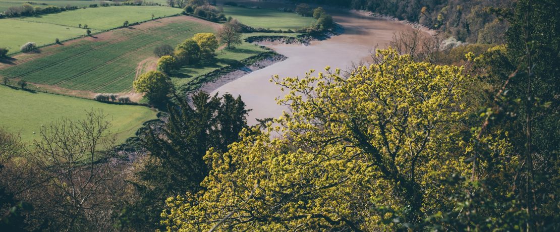 The River Wye winds below a wooded escarpment west of Hereford