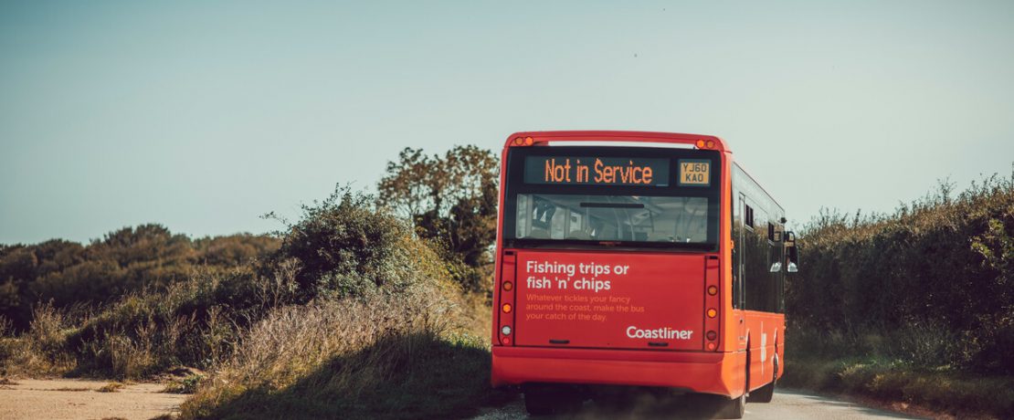 Bus being driven on a countryside road