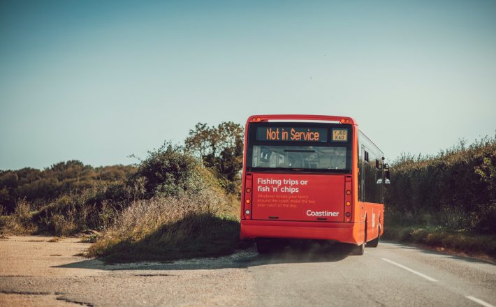 Bus being driven on a countryside road