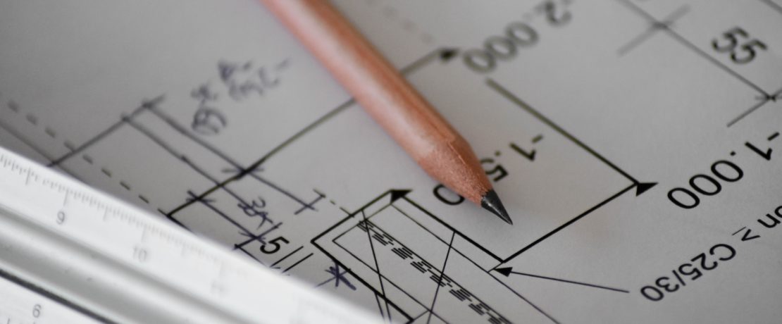 Close up of blueprint of building plans